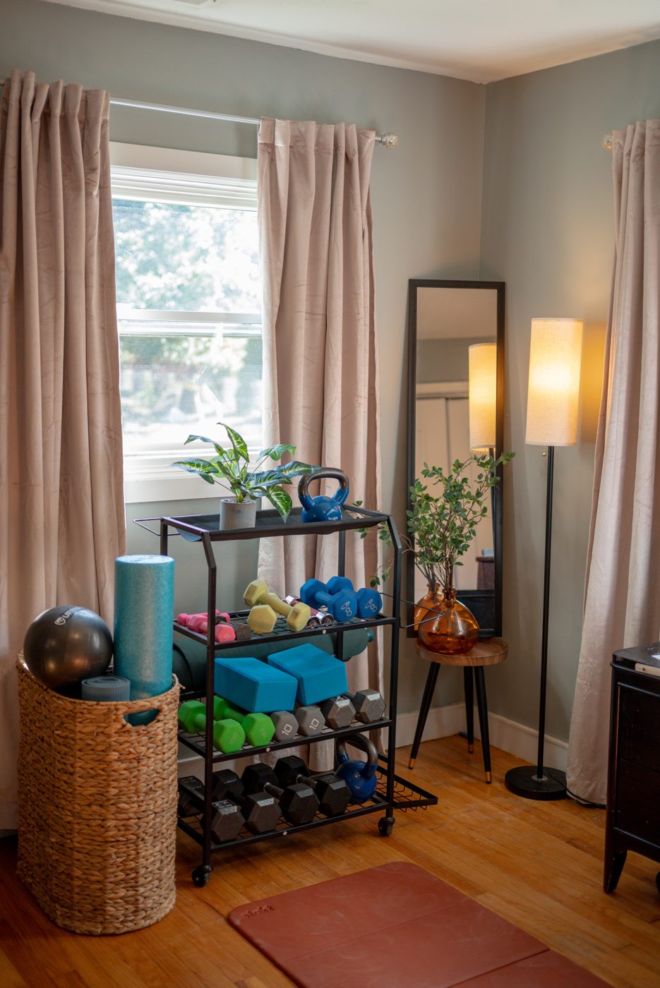 My home studio shelf with weights and a mat