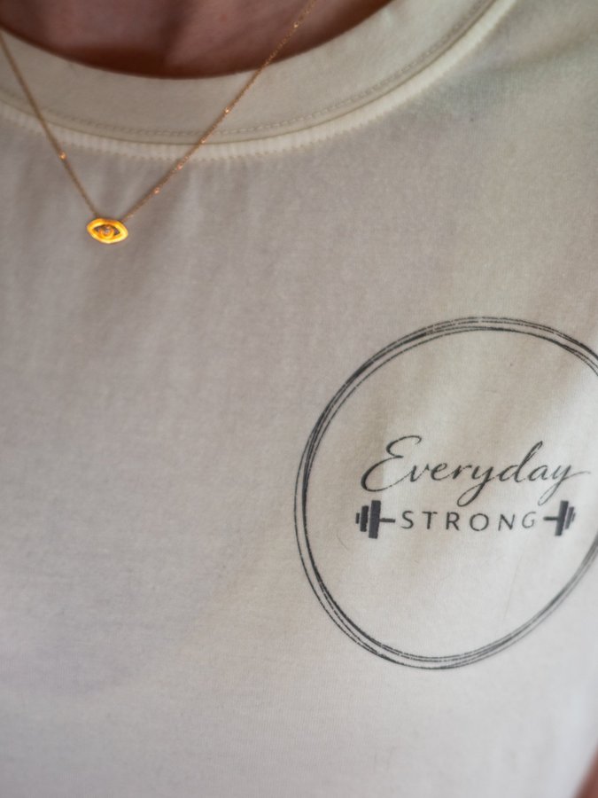 The Everyday Strong logo on my shirt